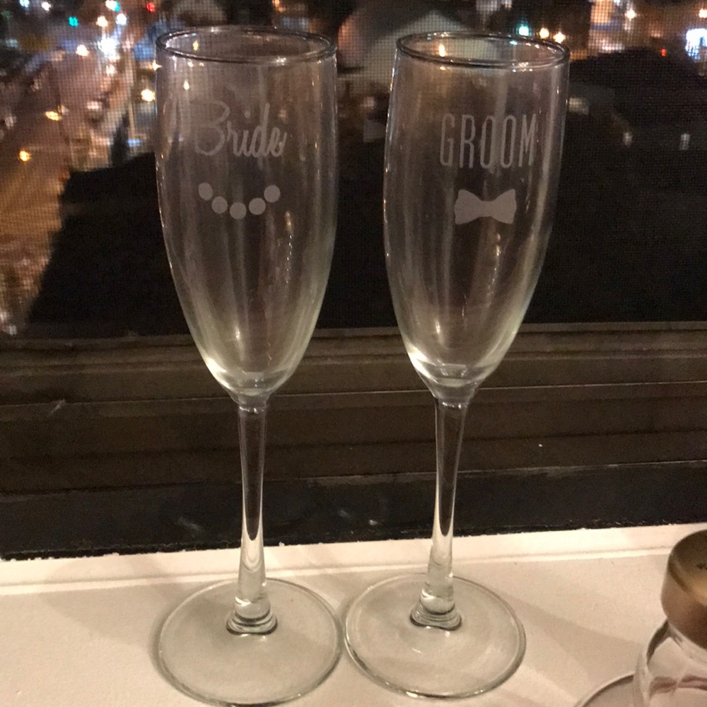 Etched glass bride and groom champagne flutes